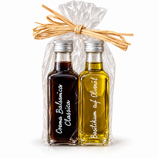Geschenkset Crema Balsamica Classica und Basilikum auf Olivenöl, je 100 ml, in Cellophan mit Bast