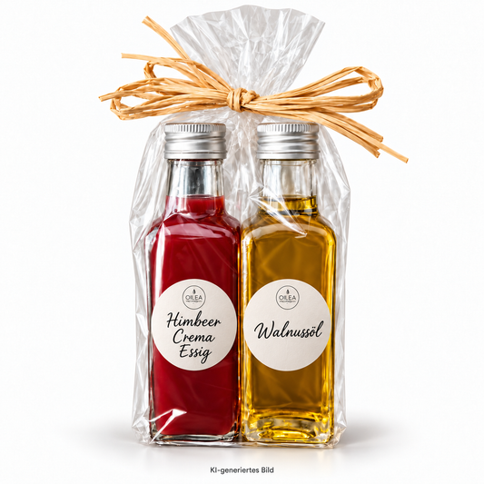 Himbeer Crema Essig und Walnussöl, 2 × 100 ml, mit runden Oilea-Etiketten, in Cellophan mit Bast