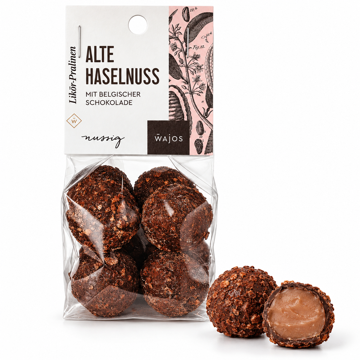 Alte Haselnuss Likör-Pralinen von Wajos – 100-g-Packung mit ganzer Praline und Anschnitt auf weißem Hintergrund